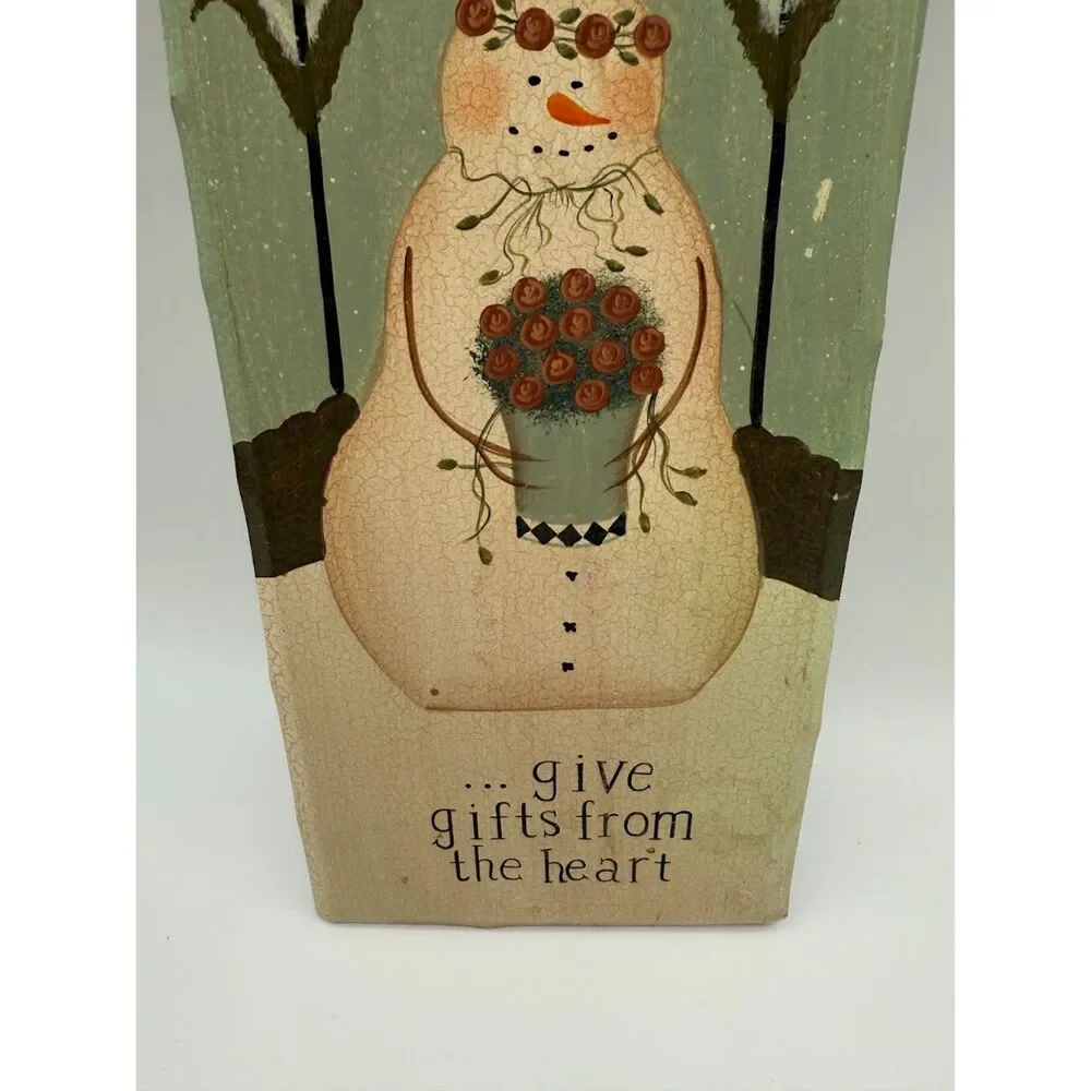 Rustic country-style snowman sign